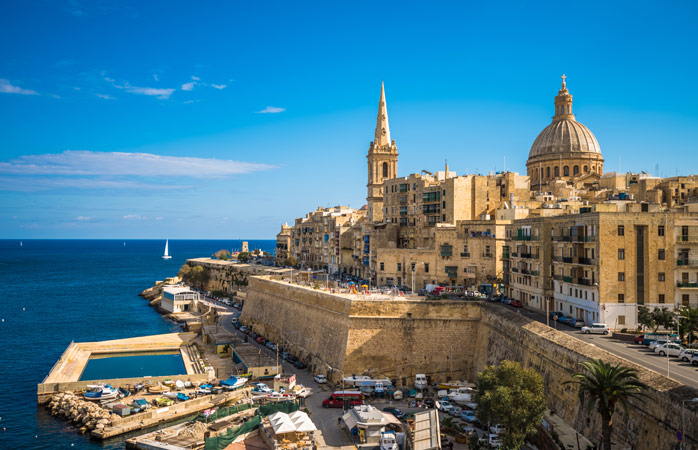The oval dome of the Basilica of Our Lady of Mount Carmel sits tall in the Maltese capital